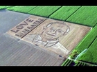 Giant pope face ploughed into field