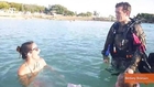 Soldier Returning Surprises Family at Beach in Scuba Gear